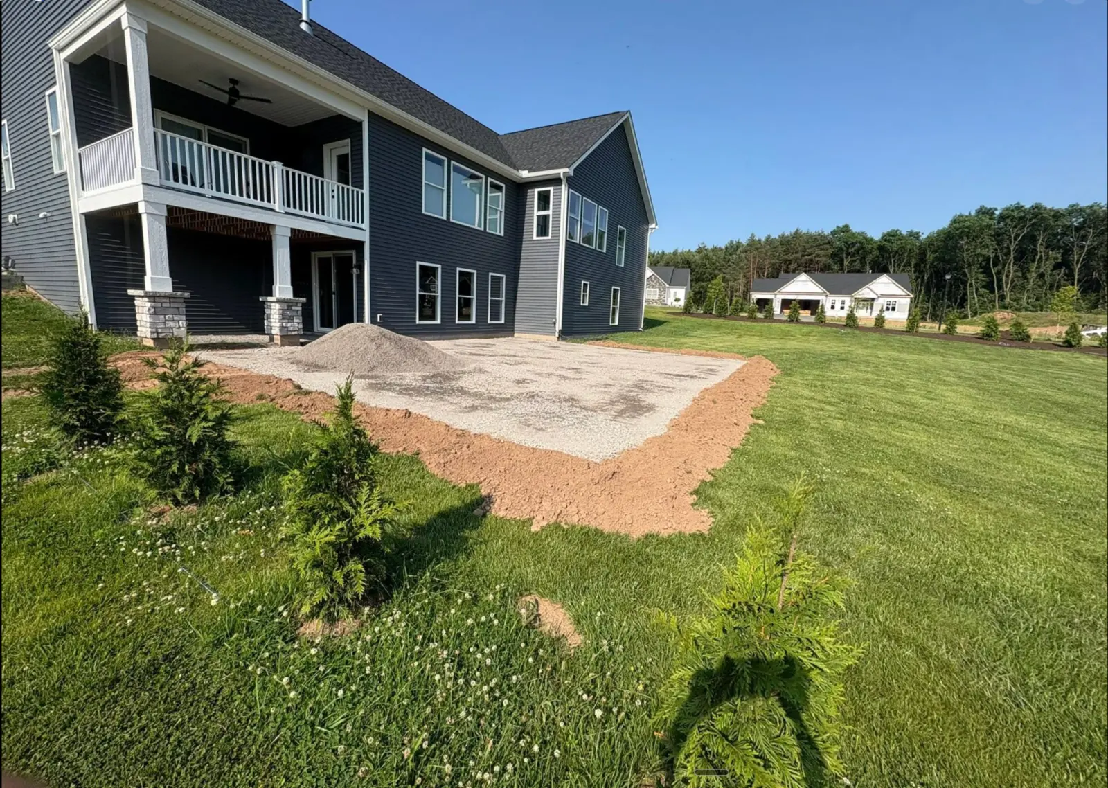 CB OnSite prepared stone base behind a residential property